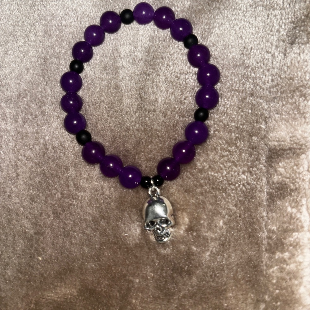 Vibrant Purple and Black Beaded Bracelet with Skull Charm
